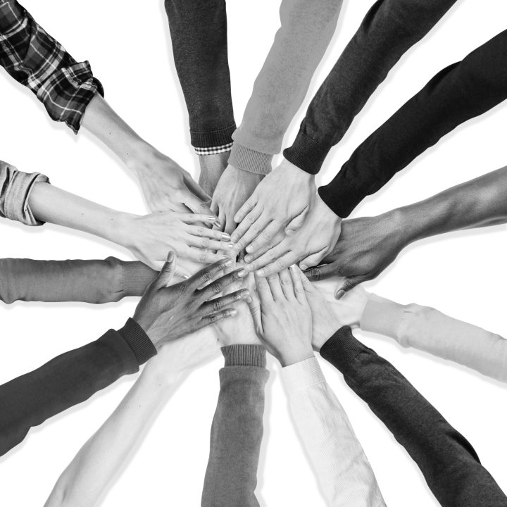 group of human hands holding together group of human hands holding together